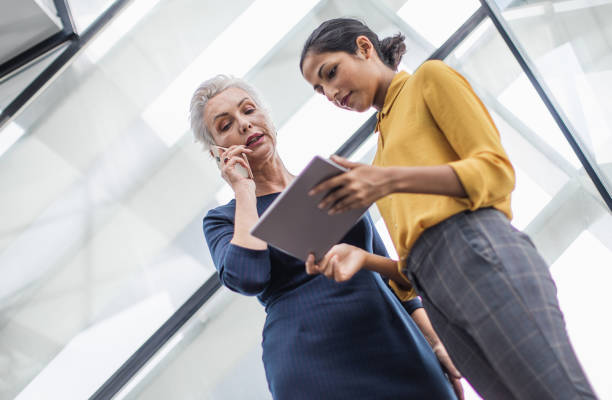 istock Two Businesswomen Discussing 1154848446