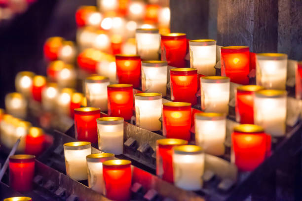 istock Burning candles in catholic church 1154850264