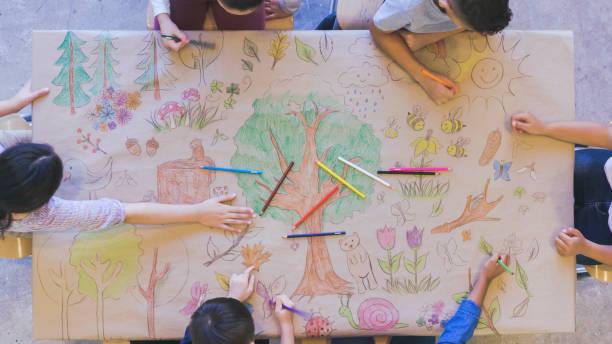 istock Kids draw mural celebrating nature 1154851594