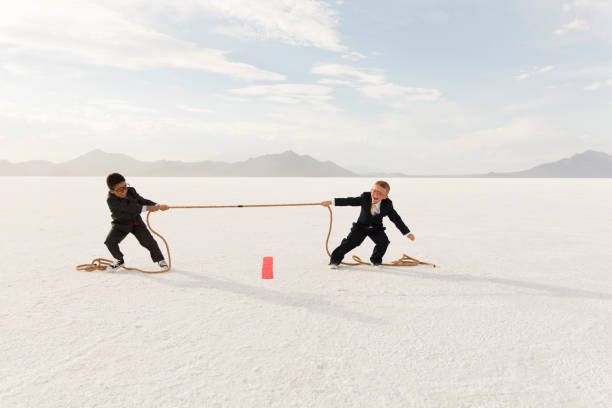 istock Young Business Boys Tug-of-War 1154854342