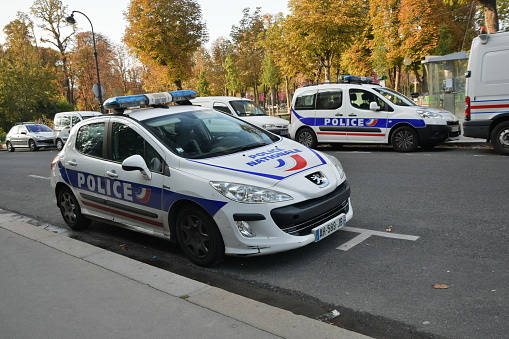 Paris, France - October 3rd, 2014: Police cars on the street. On the first plan we see the Peugeot 308. This model is a popular vehicle on the European market.