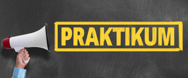 istock megaphone or bullhorn against blackboard with text PRAKTIKUM 1154860098