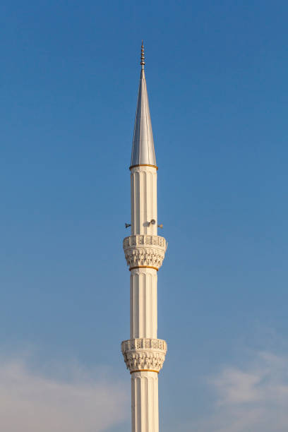 istock blue sky and minaret of mosque 1154861858