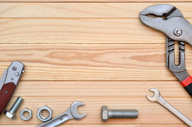 istock Manual, industrial repair tool on wooden table 1154865334