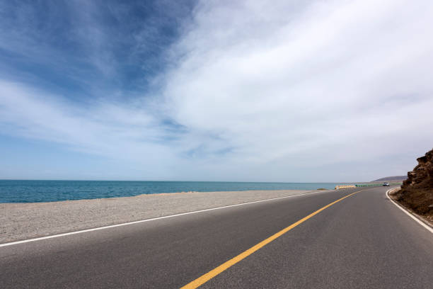 istock The lakeshore highway is against a blue sky and white clouds 1154867437