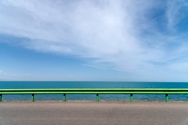 istock The lakeshore highway is against a blue sky and white clouds 1154867441