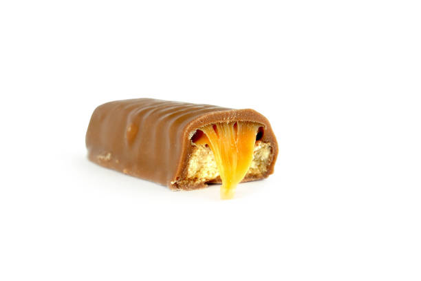 istock Chocolate bar with caramel and cookie isolated on white background 1154867782