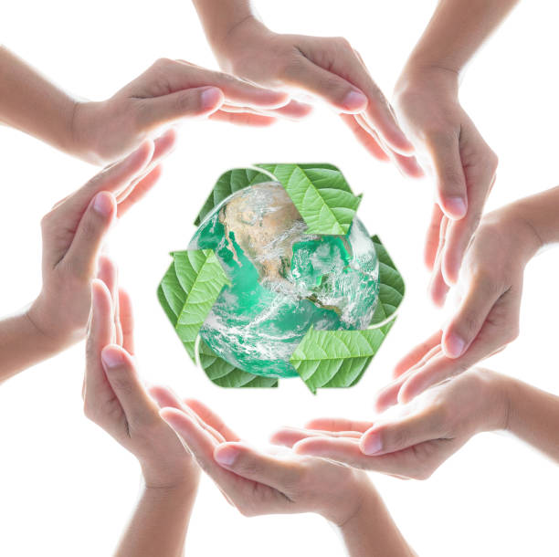 istock Hands surrounding green planet protected by recycle sign leaf on white background. Elements of this image furnished by NASA 1154872901