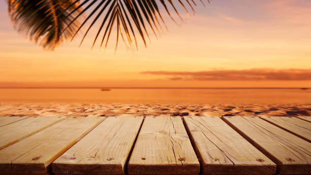 istock Wooden platform on the sunset beach 1154872994