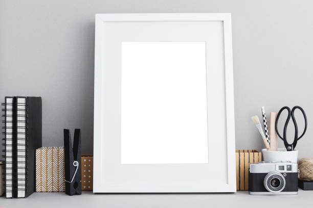 istock Picture frame isolated on bookshelf or home office desk. Mock up. 1154873506