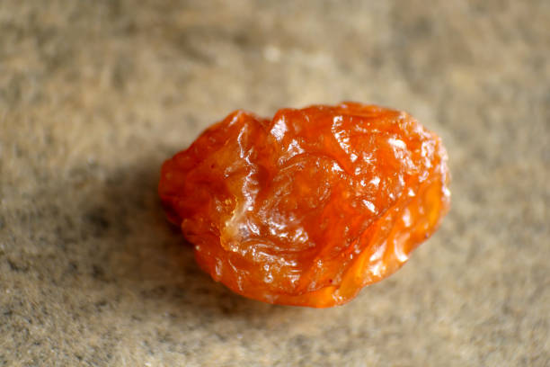 istock Close up of single raisin 1154874689