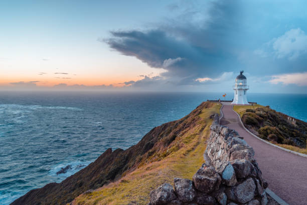 zachód słońca na przylądku reinga. - lighthouse storm sea panoramic zdjęcia i obrazy z banku zdjęć