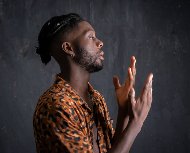 istock West African young man caught mid dance. 1154877501
