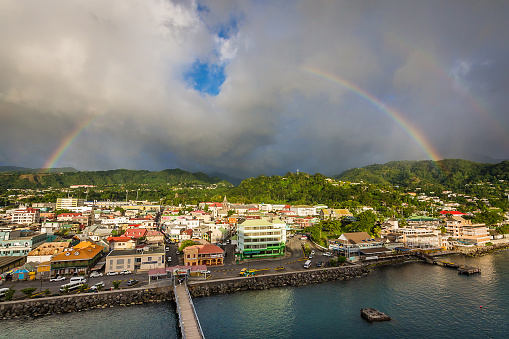 A rainstorm passes over the harbor in Roseau, Dominica