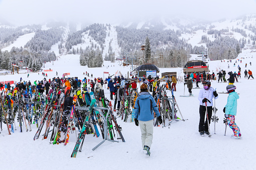 People and skis at the base of the Jackson Hole in Jackson, Wyoming December 24, 2018
