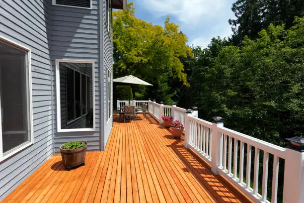 Photo of Brand new red cedar outdoor wooden patio during nice day