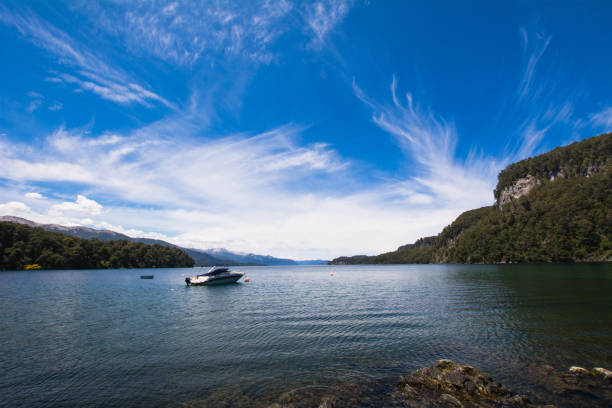 istock Boats sailing on calm lake water. 1154890423