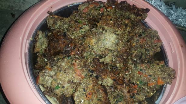 istock Closeup view with selective focus on delicious spicy fried round kebab served in a ceramic plate 1154893437