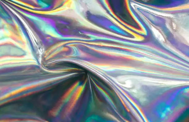 Photo of Holographic iridescent abstract blurred surface. Holographic gradient.