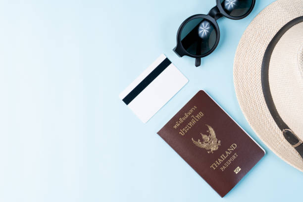istock Top view travel concept with accessories isolated over blue background 1154897971