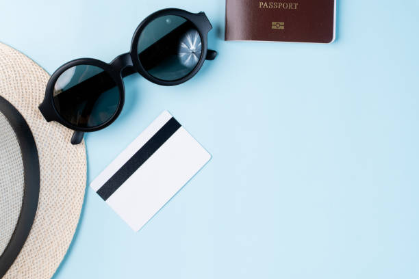 istock Top view travel concept with accessories isolated over blue background 1154897979