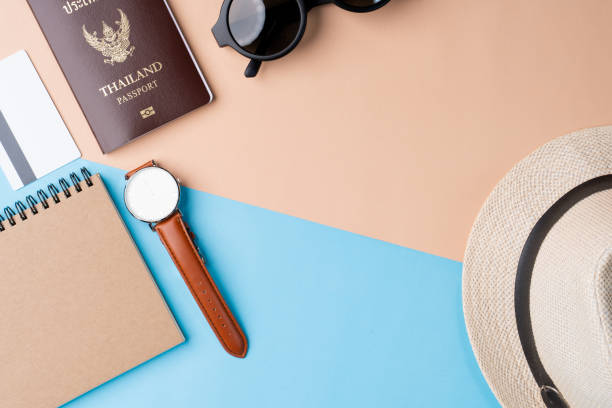 istock Top view travel concept with accessories on abstract beach background 1154898121