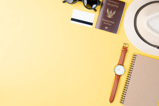 istock Top view travel concept with accessories on yellow background 1154898308