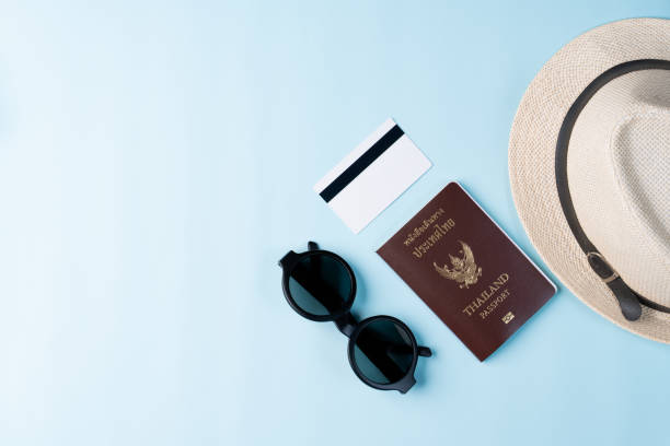 istock Top view travel concept with accessories isolated over blue background 1154898320