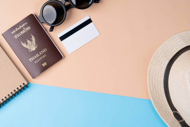 istock Top view travel concept with accessories on abstract beach background 1154898372