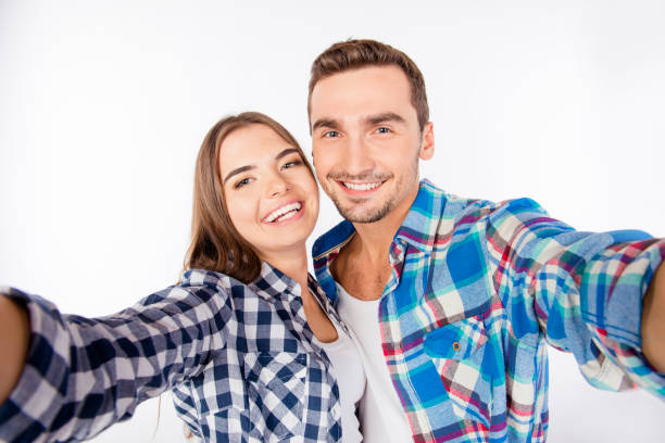 istock happy smiling young couple making selfie photo 1154909846