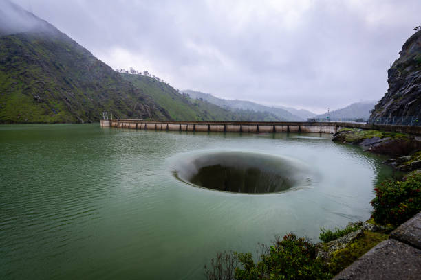 The Lake Berryessa Glory Hole The glory hole is an overflow of Lake Berryessa that occurs when the water level is beyond a particular height in the reservoir. sinkhole stock pictures, royalty-free photos & images