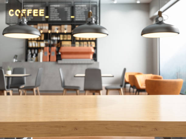 tablero de mesa de madera vacío con cafetería borrosa - mostrador en el banco fotografías e imágenes de stock