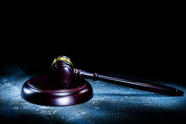 istock Judge's gavel lies on a stone table. 1154917941