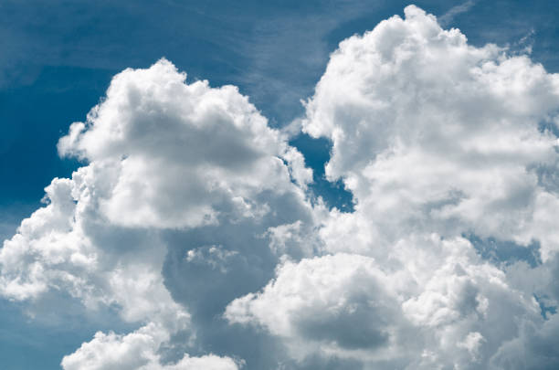 istock Incredibly wonderful lush cumulus clouds against a blue sky 1154918733
