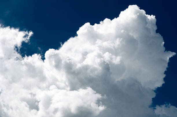istock Incredibly wonderful lush cumulus clouds against a blue sky 1154918809