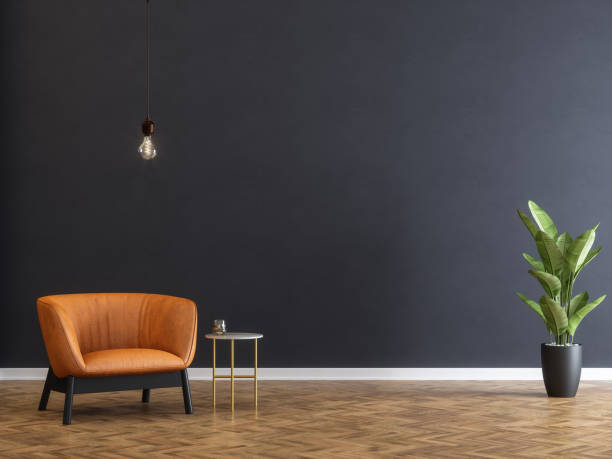 armchair and coffee table with black wall - soft lighting imagens e fotografias de stock