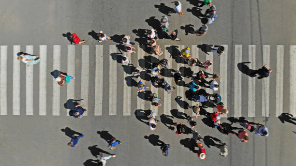 istock Aerial. Pedestrian crowd on a crosswalk. Top view. 1154920774