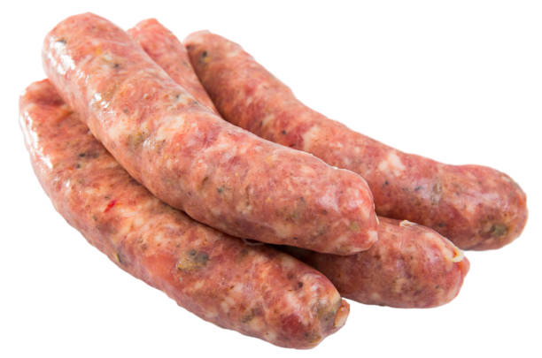 istock Uncooked sausages with mushrooms 1154920938
