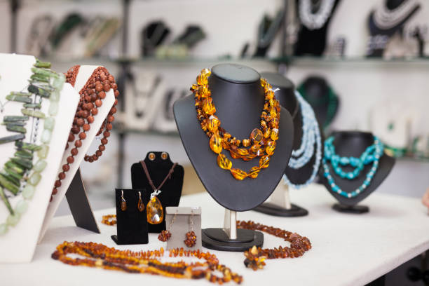 istock Counter with amber jewelry in store 1154920975