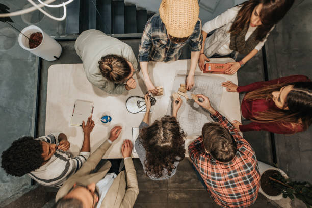 istock Above view of freelance workers making creative ideas in the office. 1154921774