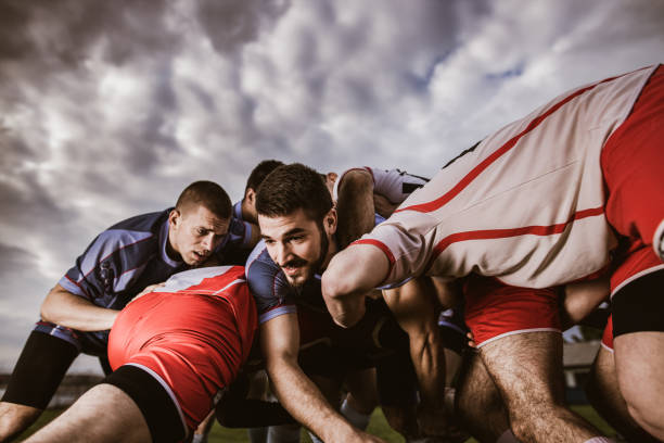 istock Rugby players blocking their opponent on a match at playing field. 1154923475