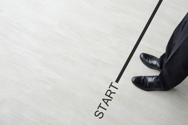 Business man standing on starting line