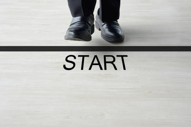 Business man standing on starting line