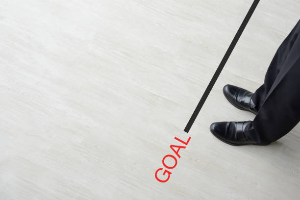 istock Business man standing on goal line 1154925454