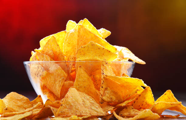 istock Composition with bowl of potato chips. 1154925826