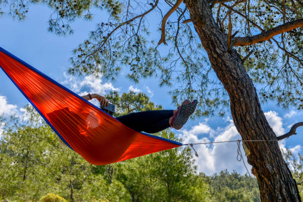 istock Happy woman in hammock. 1154928534
