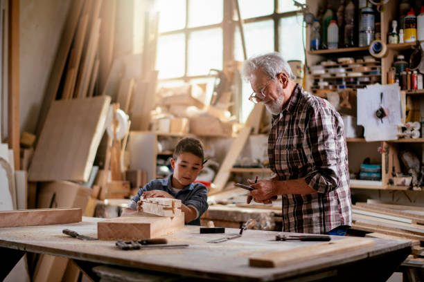 istock Grandfather teaching his grandson 1154929748