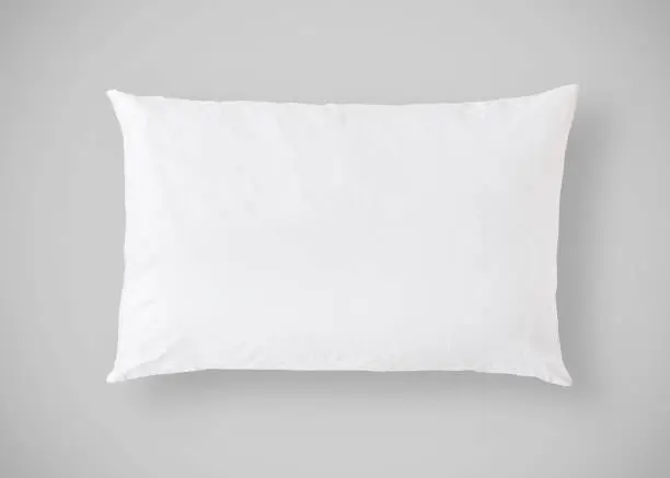 White pillow on grey background isolated with clipping path for bedding mockup design template
