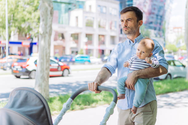 istock Father and baby son walking 1154940575
