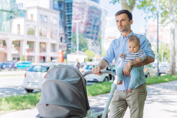 istock Father and baby son walking 1154940622